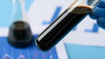 Crude oil in vial test tube in laboratory scientist hand. Crude oil in vial test tube in laboratory scientist hand.
